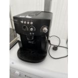 A BLACK DELONGHI MAGNIFICA COFFEE MAKER