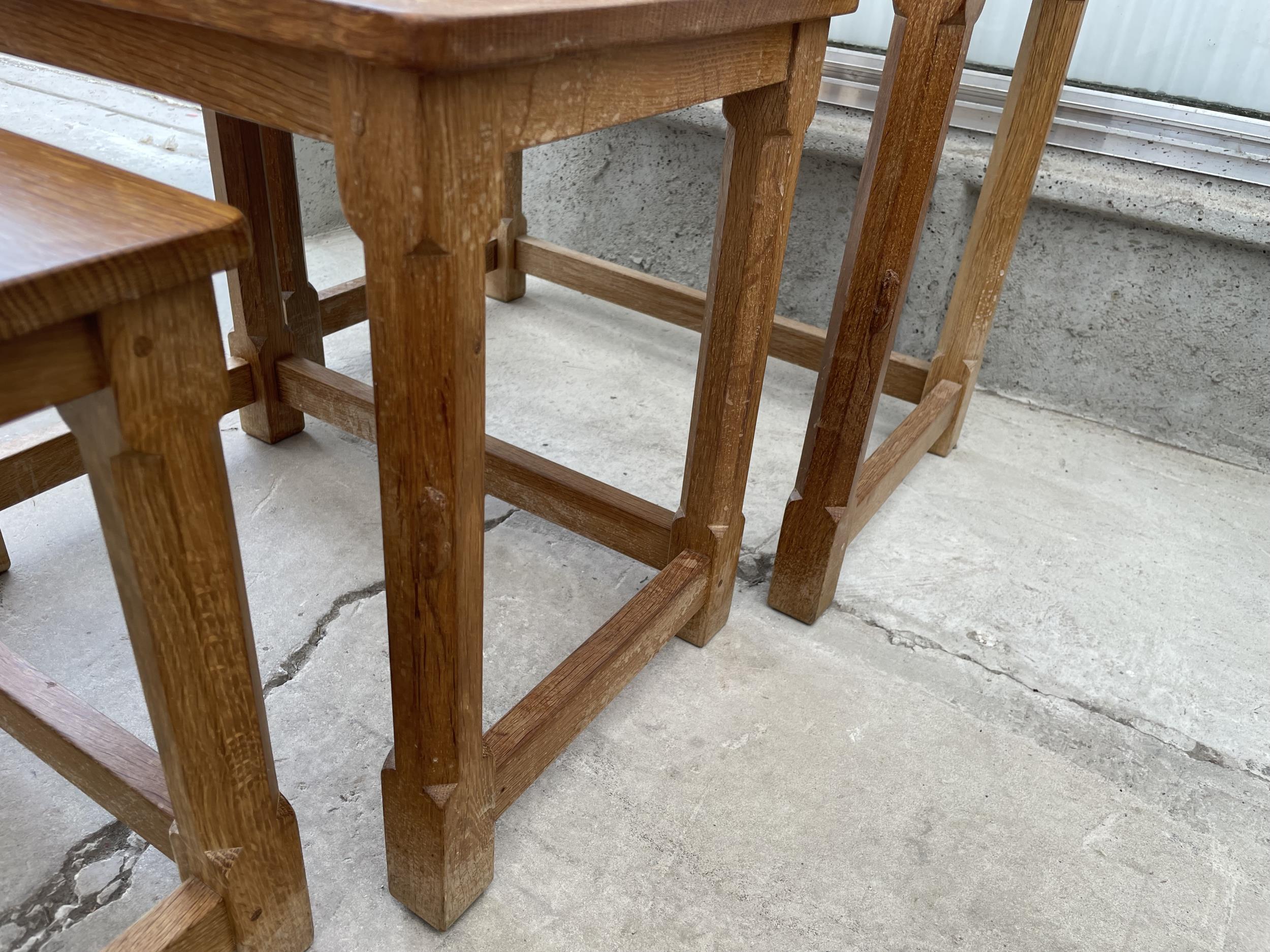 A MID 20TH CENTURY ROBERT 'MOUSEMAN' THOMPSON NEST OF THREE OAK TABLES ON OCTAGONAL LEGS, WITH ADZED - Image 6 of 7