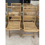 A SET OF FOUR NEW TEAK FOLDING GARDEN CHAIRS