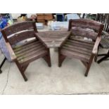 A WOODEN GARDEN LOVE SEAT WITH TWO CHAIRS AND A JOINING TABLE