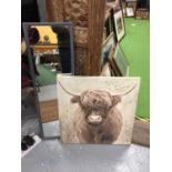 A PRINT ON CANVAS OF A HIGLAND COW 60CM X 60CM PLUS A FRAMED GREY WALL MIRROR 93CM X 31CM