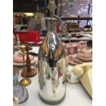 A LARGE SILVER COLOURED 'BOTTLE' LAMP HEIGHT 38CM