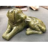 A JADE FIGURE OF A DOG LYING DOWN HEIGHT 8CM, LENGTH 15CM