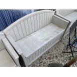 A PLASTIC SUNCAST GARDEN BENCH WITH UNDER SEAT STORAGE