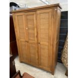 A MODERN OAK TRIPLE DOOR WARDROBE, 59" WIDE