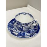 A ROYAL CROWN DERBY ORIENTAL DESIGN BLUE AND WHITE CUP AND SAUCER