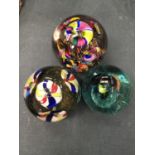 THREE GLASS PAPERWEIGHTS WITH COLOURED INSIDES
