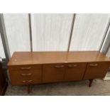 AN AVALON RETRO TEAK SIDEBOARD BY AVALON ENCLOSING THREE CUPBOARDS AND THREE DRAWERS, 72" WIDE