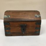 A MAHOGANY CHEST WITH METAL BANDING AND HANDLES WITH A DOMED LID 23CM X 15.5CM X 15CM