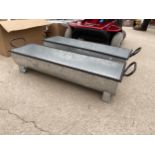 A PAIR OF SMALL METAL TROUGH PLANTERS