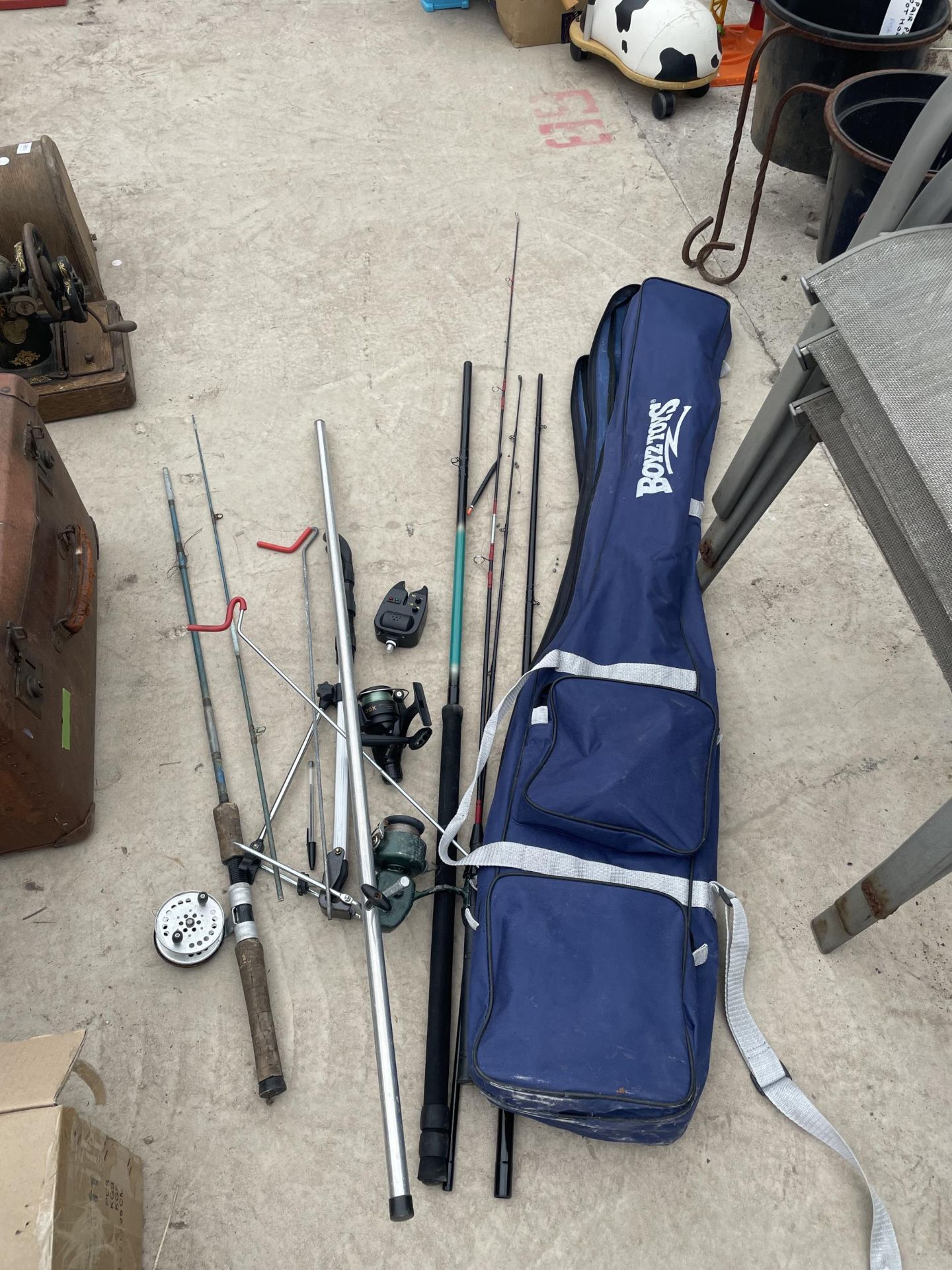 A BOYZ TOYS CARRY BAG WITH AN ASSORTMENT OF FISHING RODS