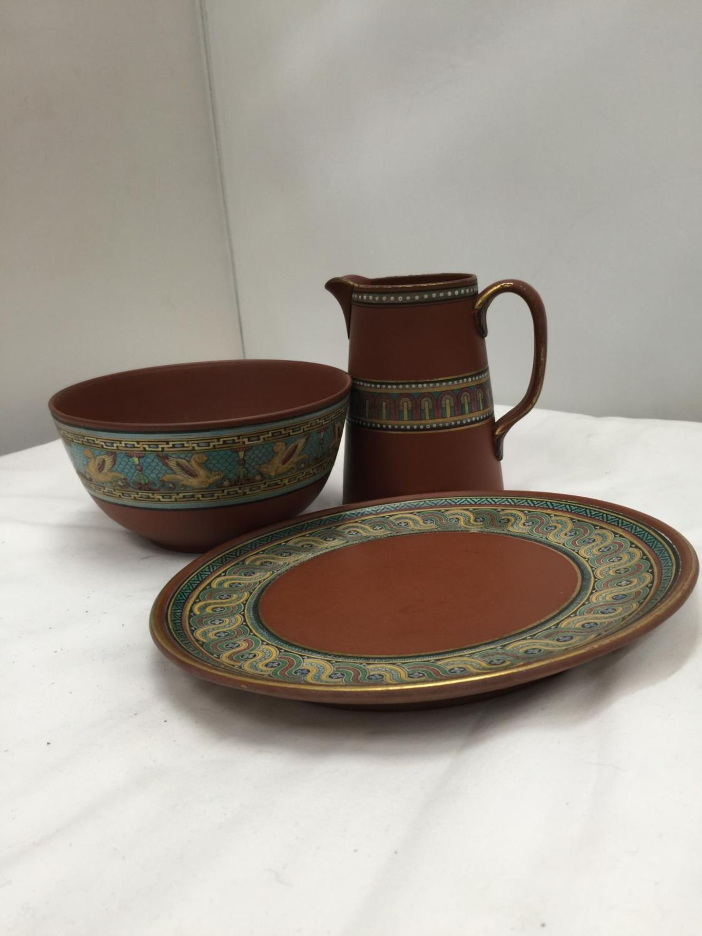 THREE PIECES OF PATTERNED TERRACOTA POTTERY