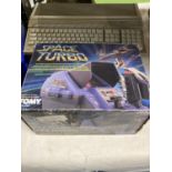 AN ATARI 1040 ST COMPUTER GAME KEYPAD AND A BOXED SPACE TURBO GAME CONSOLE