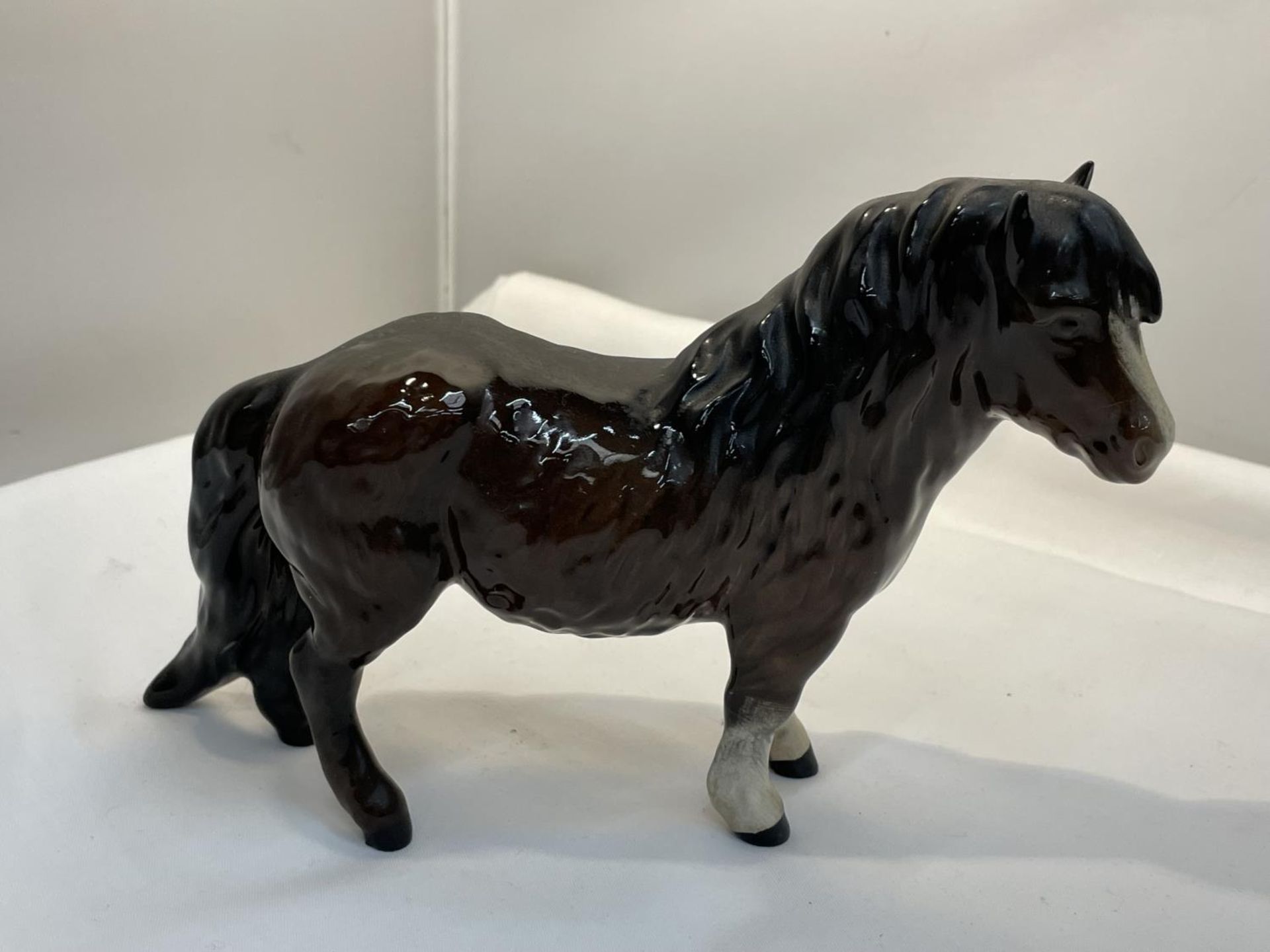 A ROYAL DOULTON BAY GLOSS SHETLAND PONY