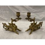 A PAIR OF BRASS 'WELSH DRAGON' CANDLESTICKS HEIGHT 17.5CM, LENGTH 17CM