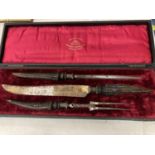 A BOXED VINTAGE CARVING SET WITH THE NAME THOMAS TURNER & CO, SHEFFIELD