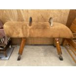 A VINTAGE POMMEL HORSE WITH HOOP BARS, ON FOUR ADJUSTABLE LEGS, 65X24" MAX WITH SUEDE TOP