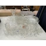 A LARGE ASSORTMENT OF GLASS WARE TO INCLUDE TRIFLE BOWLS AND CUT GLASS BRANDY BALOONS ETC