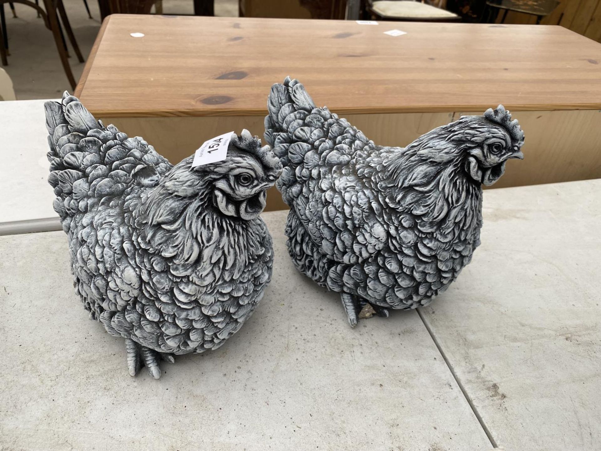 A PAIR OF RECONSTITUTED STONE PEKIN HEN FIGURES (A/F)
