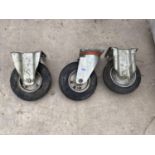 A SET OF THREE INDUSTRIAL TROLLEY BASE WHEELS