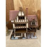 A LARGE VINTAGE WOODEN DOLLS HOUSE WITH AN ASSORTMENT OF DOLLS FURNITURE