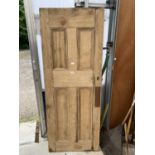 A VINTAGE INTERNAL PINE DOOR WITH COPPER PUSH PLATES