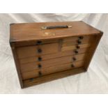 A VINTAGE MAHOGANY ENGINEERS CHEST WITH DOVE TAILED JOINTS AND METAL CORNERS. WITH MAKERS MARK M &