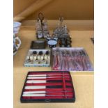 A QUANTITY OF BOXED FLATWARE TO INCLUDE KNIVES, FORKS, SPOONS, CRUET SETS WITH STANDS, ETC