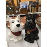 A PAIR OF BLACK AND WHITE SCOTTIE DOG BISCUIT BARRELS