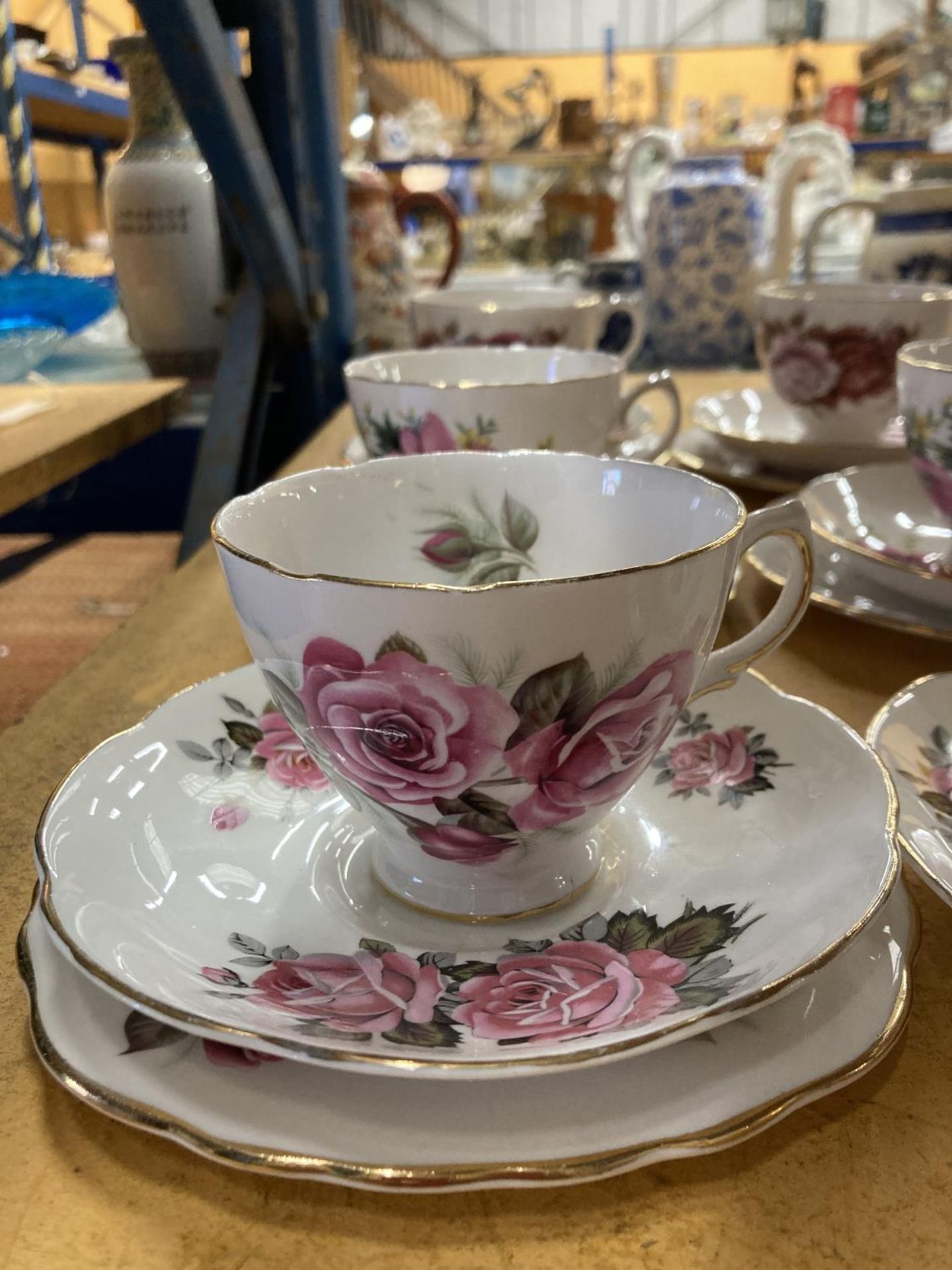 A QUANTITY OF BONE CHINA 'ROSE' PATTERNED TRIOS PLUS A COALPORT 'JUNETIME' CUP AND SAUCER AND A - Image 7 of 8