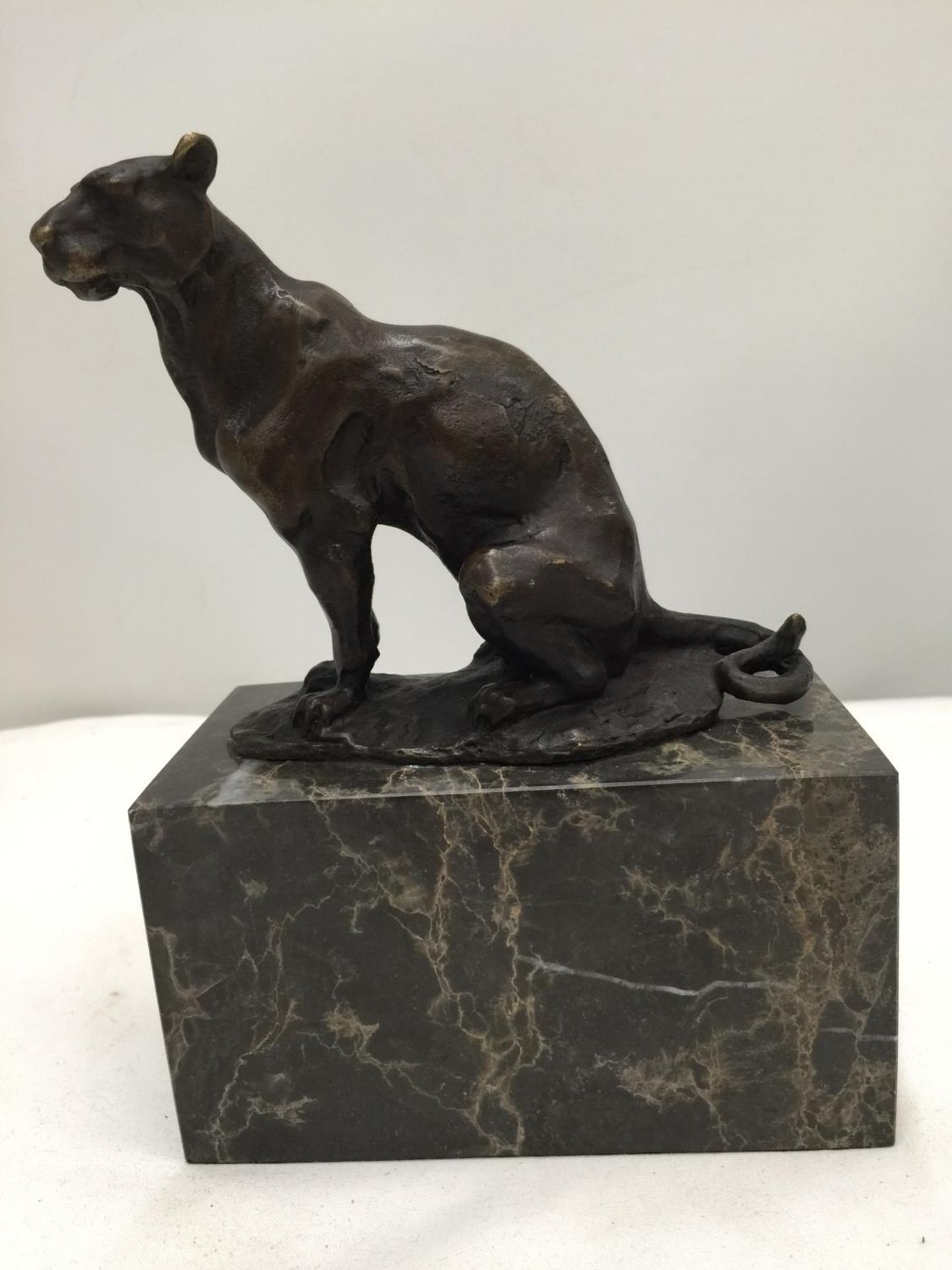 A BRONZE PANTHER ON A MARBLE BASE SIGNED CARVIN HEIGHT 18CM