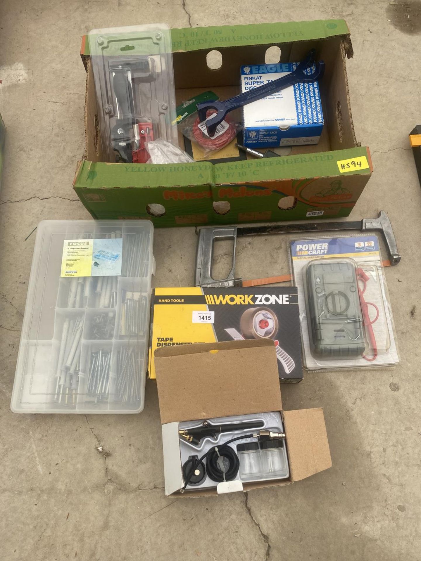 AN ASSORTMENT OF ITEMS TO INCLUDE A TAPE DISPENSOR, A DIGITAL MULTIMETER AND A HACK SAW ETC