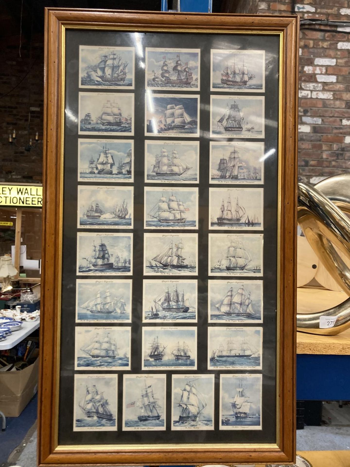 A FRAMED SET OF PLAYER'S CIGARETTE CARDS DEPICTING SHIPS 64CM X 36CM