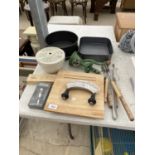 AN ASSORTMENT OF ITEMS TO INCLUDE A MINCER, CAKE TINS AND A HERB BOARD ETC