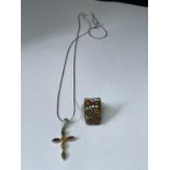 A MARKED SILVER NECKLACE WITH AMBER CROSS PENDANT AND AN AMBER RING