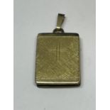 A 14 CARAT GOLD RECTANGULAR RELIGIOUS LOCKET GROSS WEIGHT 5.6 GRAMS