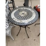 A ROUND TILE TOPPED CAST IRON BISTRO TABLE