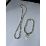 A SILVER BALL NECKLACE WITH BRACELET AND LOVE HEART