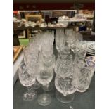 A QUANTITY OF GLASSES TO INCLUDE CUT GLASS WINE, SHERRY, CHAMPAGNE FLUTES, ETC