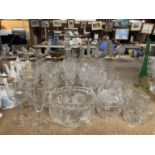 A QUANTITY OF CUT GLASS TO INCLUDE A JUG, WINE, SHERRY, BRANDY, PORT GLASSES, ETC