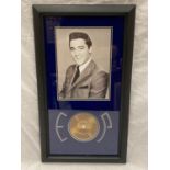 A FRAMED PICTURE OF ELVIS PRESLEY PLUS A STRAND OF HIS HAIR WITH CERTIFICATE OF AUTHENTICITY