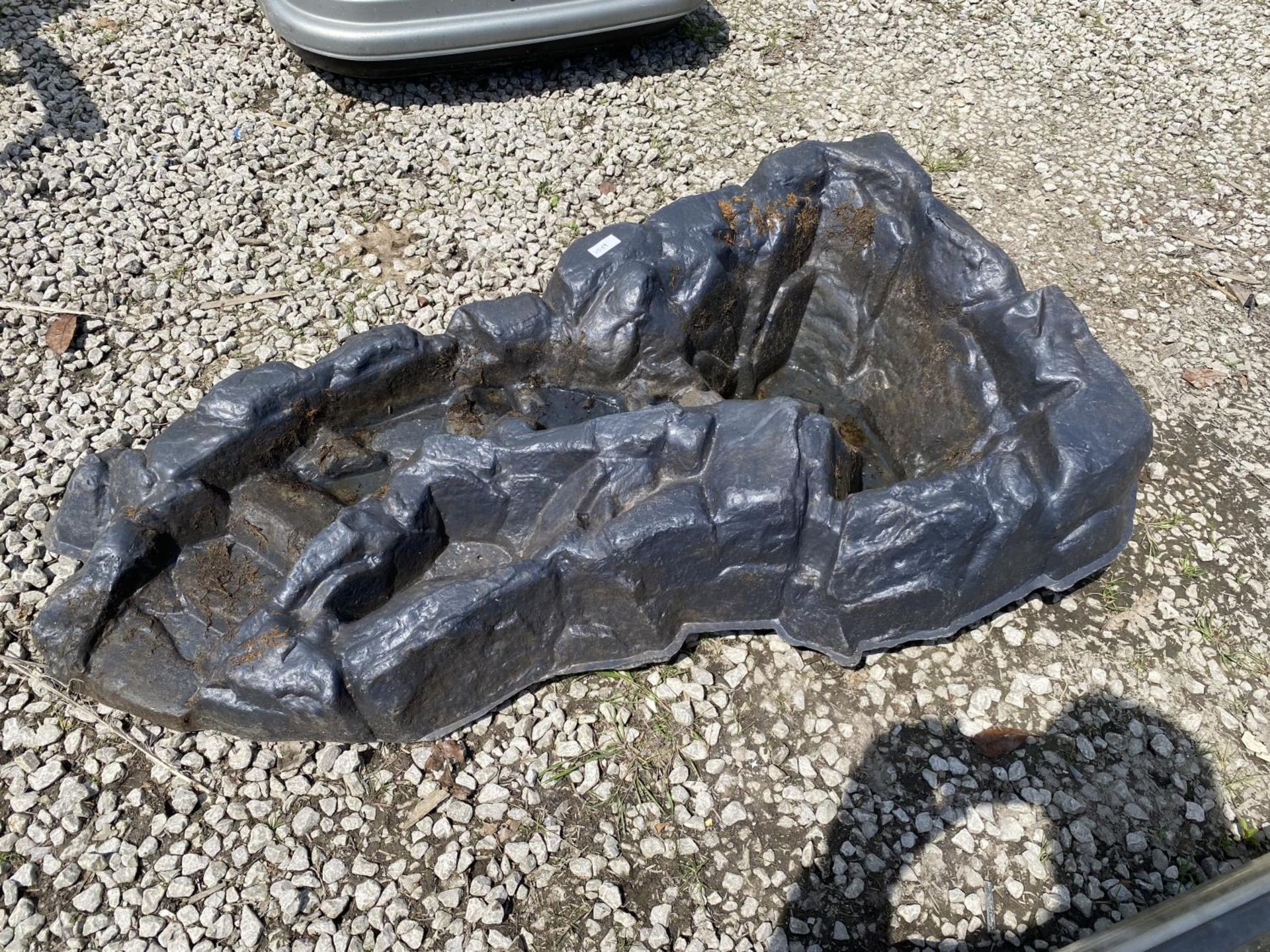 A PLASTIC WATER FEATURE POND LINER