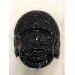 A BLACK STONE MASK 14CM X 12CM