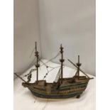 A WOODEN MODEL OF A SHIP WITH RIGGING LENGTH 29CM