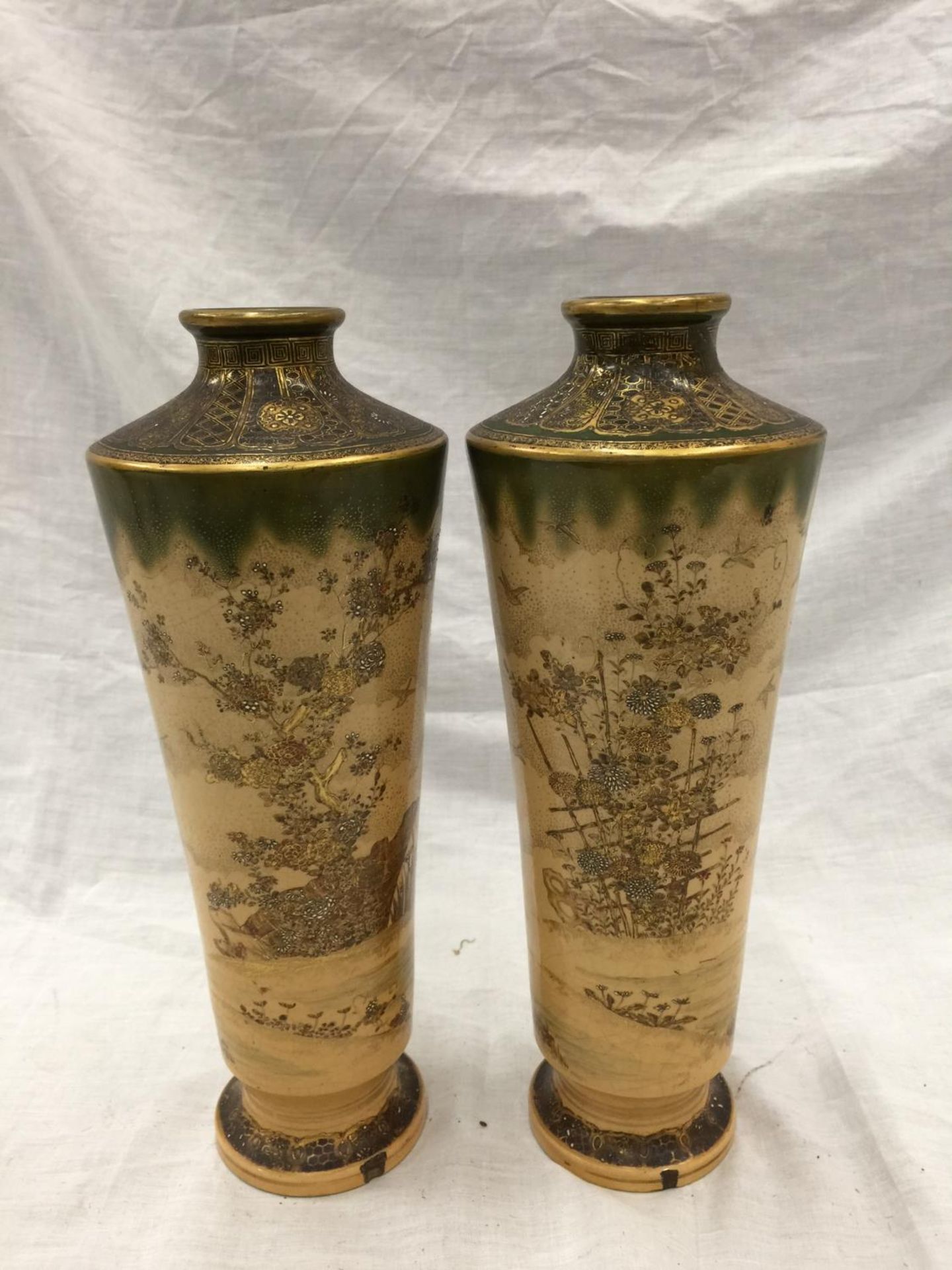 A PAIR OF ORIENTAL CLOISONNE VASES DECORATED WITH CHINOISERIE CHRYSANTHEMUMS AND GREEN ENAMELLING TO