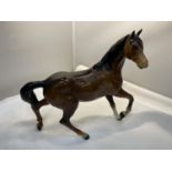 A ROYAL DOULTON GLOSS BAY PRANCING HORSE