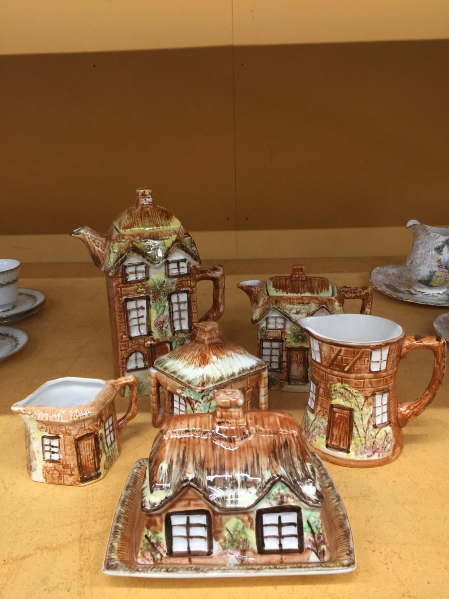 A QUANTITY OF PRICES COTTAGE WARE TO INCLUDE A TEAPOT, COFFEE POT, CHEESE DISH, JUGS, ETC