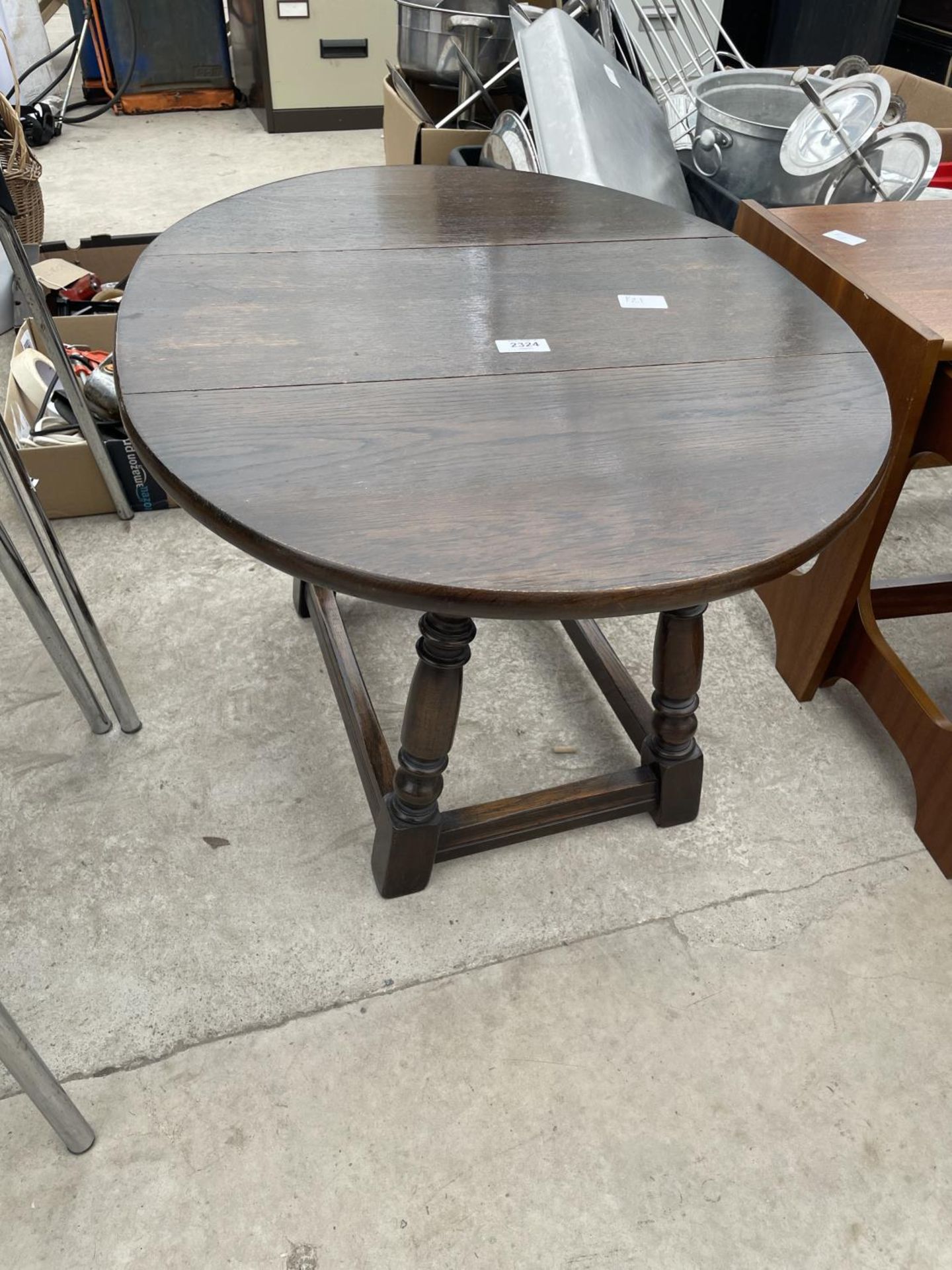 A MINIATURE DROP-LEAF TABLE ON TURNED LEGS