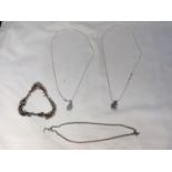 FOUR MARKED SILVER NECKLACES THREE WITH PENDANTS