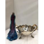 A SILVER PLATED TWISTED FOOTED , FLUTED BOWL H:16CM W:33CM AND A COLOURED GLASS OIL LAMP H: 30CM